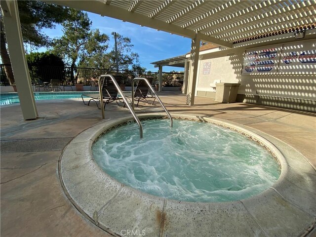 22272 Redwood Pointe Unit 5C, Lake Forest, CA 92630 - community pool with a pergola, a hot tub, fence, and a patio