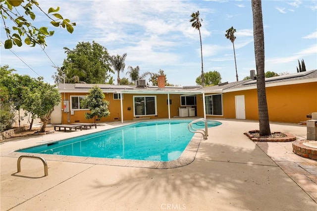 pool featuring a patio area