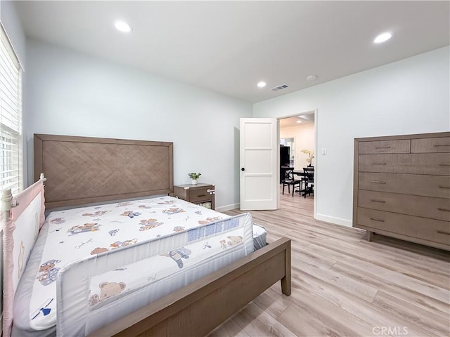 bedroom with recessed lighting, baseboards, visible vents, and light wood-type flooring