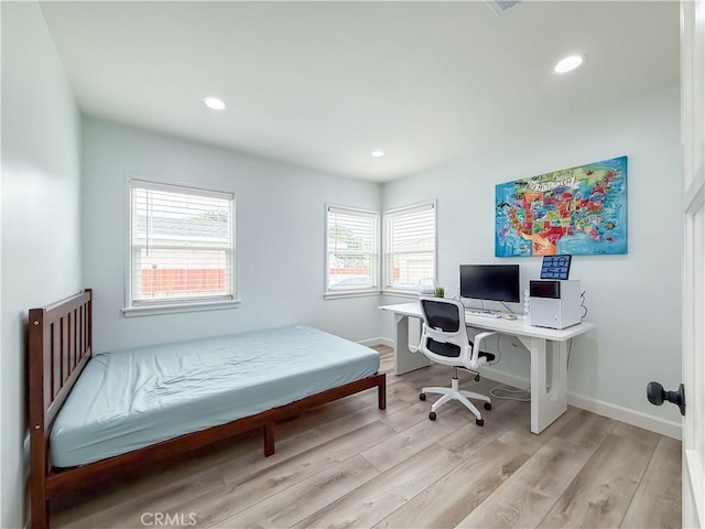 bedroom featuring recessed lighting, baseboards, and light wood-style flooring