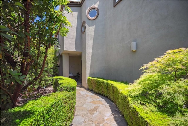 entrance to property with stucco siding