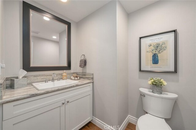 27550 N Bay Rd, Lake Arrowhead, CA 92352 - bathroom with vanity, toilet, recessed lighting, and baseboards