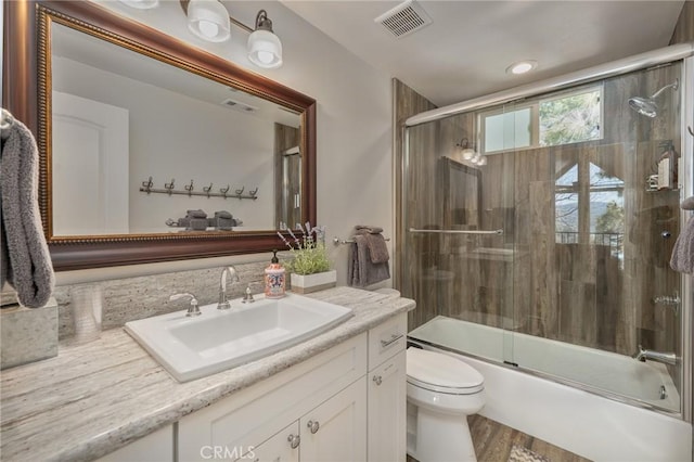 27550 N Bay Rd, Lake Arrowhead, CA 92352 - bathroom featuring vanity, toilet, shower / bath combination with glass door, and recessed lighting