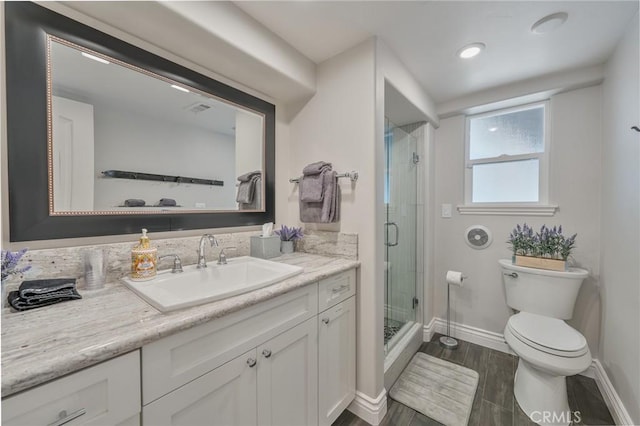 27550 N Bay Rd, Lake Arrowhead, CA 92352 - full bath with toilet, baseboards, a shower stall, vanity, and wood finished floors