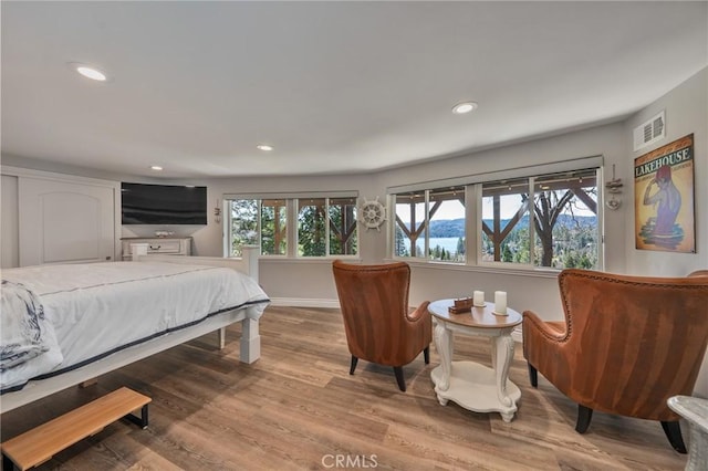 27550 N Bay Rd, Lake Arrowhead, CA 92352 - bedroom with multiple windows, recessed lighting, wood finished floors, and baseboards