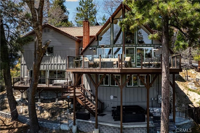 27550 N Bay Rd, Lake Arrowhead, CA 92352 - back of property featuring a deck, a chimney, stairway, and a tiled roof
