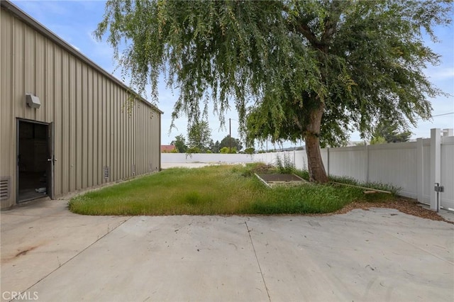 view of yard with fence and a patio area