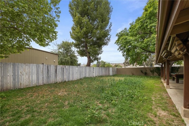 view of yard featuring a fenced backyard and a patio area