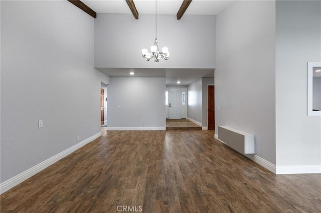 interior space with baseboards, high vaulted ceiling, an inviting chandelier, and dark wood finished floors