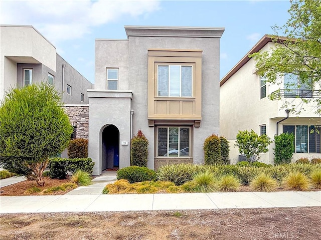 119 Bravo, Irvine, CA 92618 - view of front of home with stucco siding