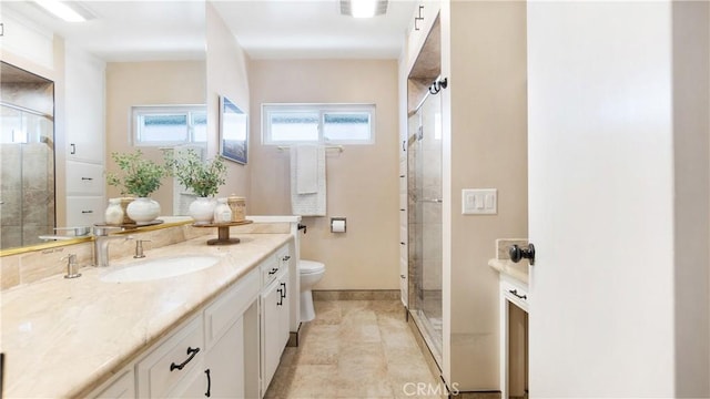 bathroom featuring vanity, a stall shower, visible vents, and toilet