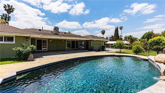 view of pool with fence, a fenced in pool, area for grilling, and a patio