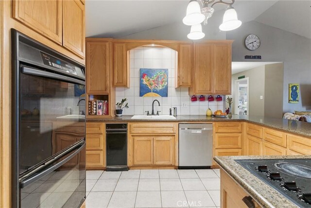 kitchen featuring a sink, decorative backsplash, vaulted ceiling, and black appliances