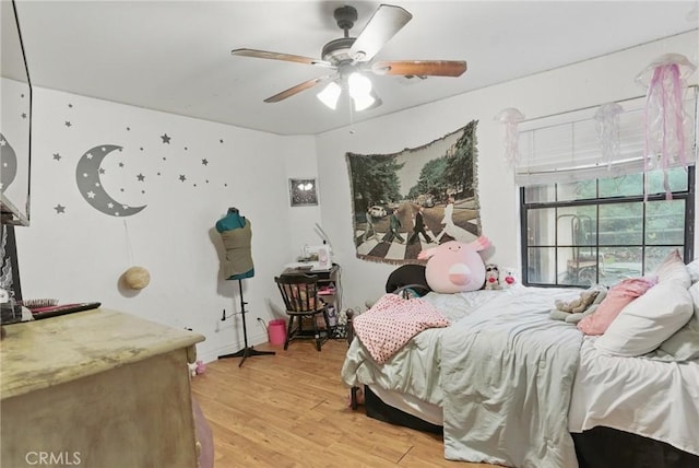 bedroom featuring a ceiling fan and light wood-type flooring