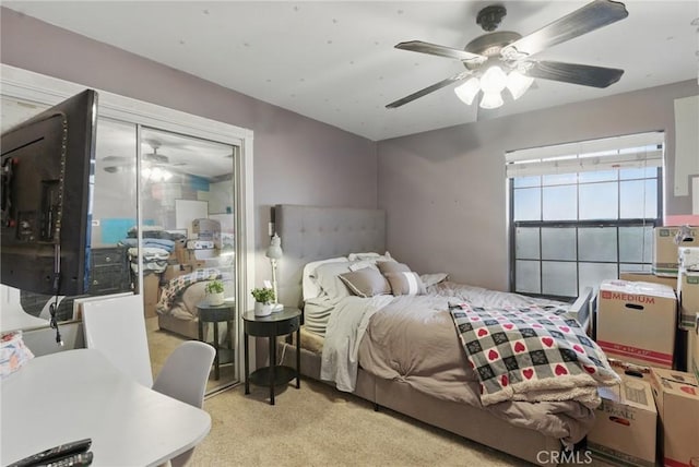 carpeted bedroom featuring a ceiling fan