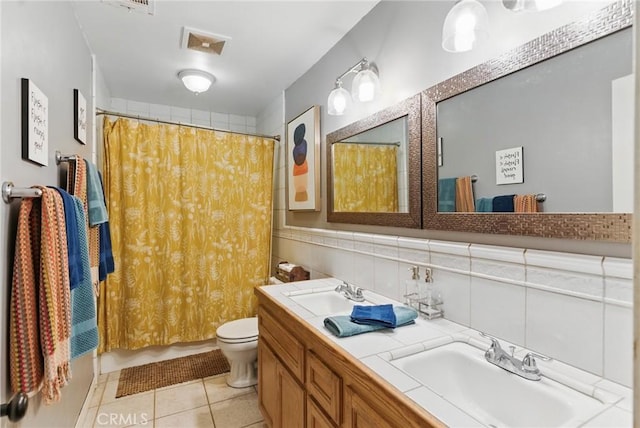 full bath featuring a sink, tile patterned floors, toilet, and visible vents