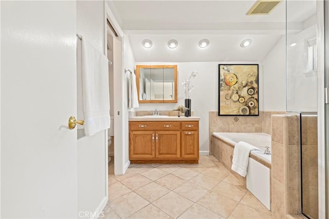 full bathroom with tile patterned flooring, vanity, a shower with door, visible vents, and a garden tub