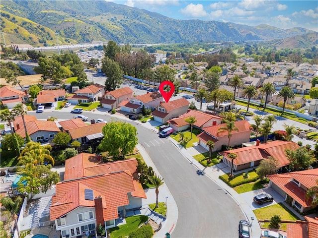 drone / aerial view featuring a mountain view and a residential view