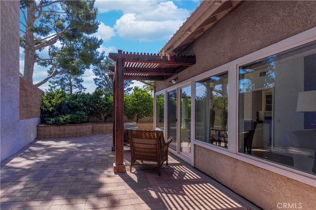wooden terrace with a patio and a pergola