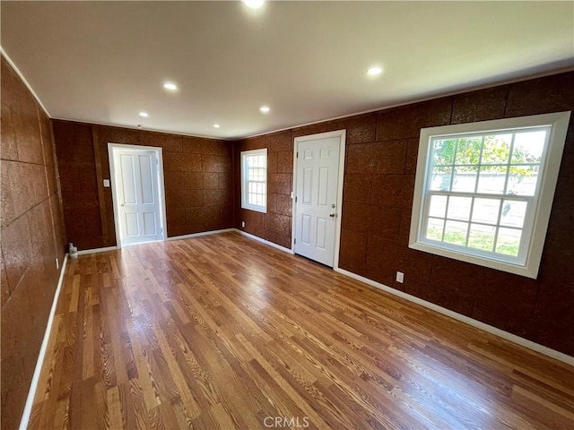 entryway featuring baseboards, recessed lighting, and wood finished floors