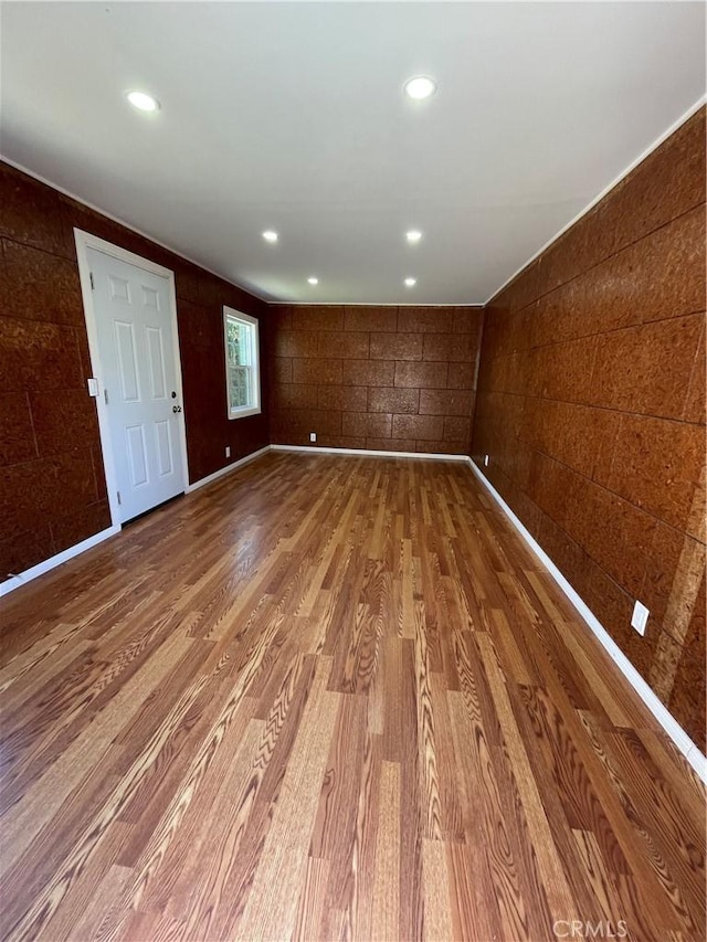 unfurnished room with recessed lighting and wood finished floors