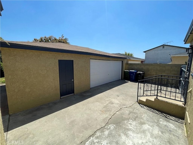 garage with fence