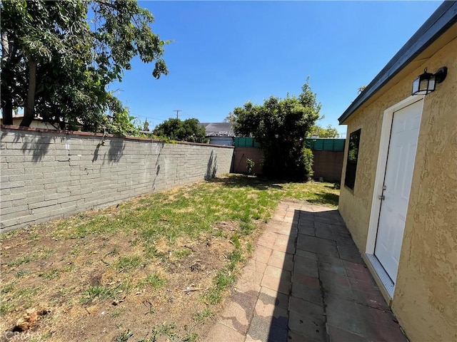 view of yard with a fenced backyard