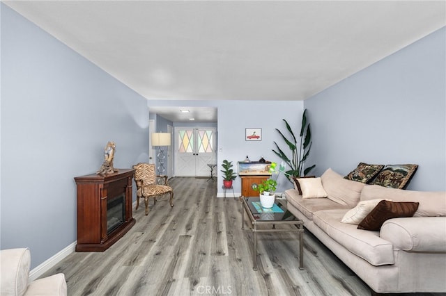 1530 Greenbriar Ave, Corona, CA 92878 - living room with baseboards and light wood-type flooring