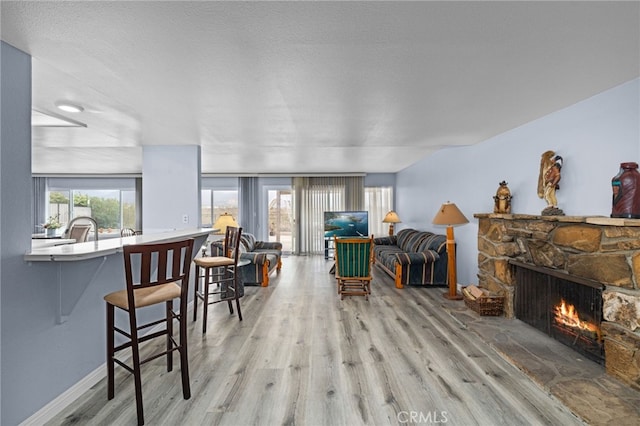 1530 Greenbriar Ave, Corona, CA 92878 - living room with a fireplace and wood finished floors