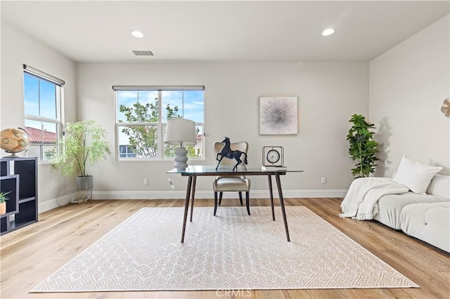 office space with visible vents, recessed lighting, baseboards, and wood finished floors
