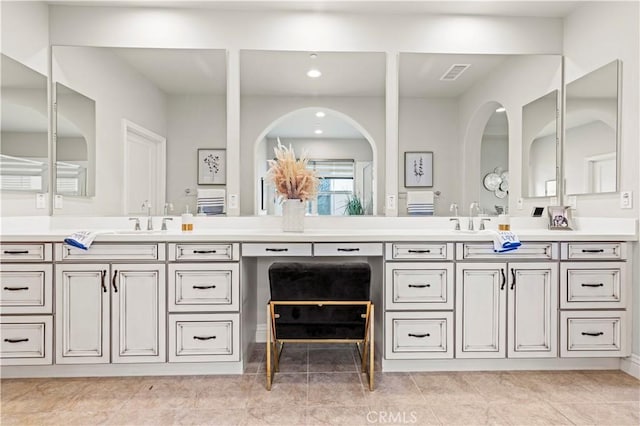 bathroom featuring recessed lighting, visible vents, and vanity