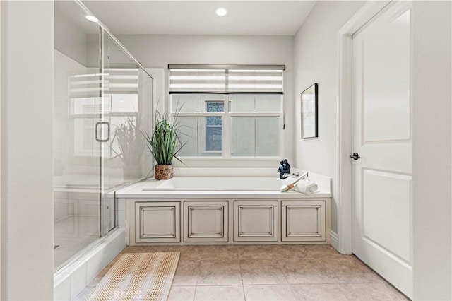 bathroom featuring tile patterned flooring, a shower stall, recessed lighting, and a bath