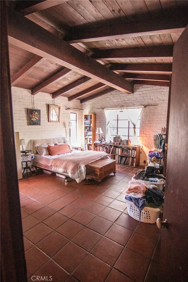 tiled bedroom featuring wood ceiling, multiple windows, lofted ceiling with beams, and brick wall