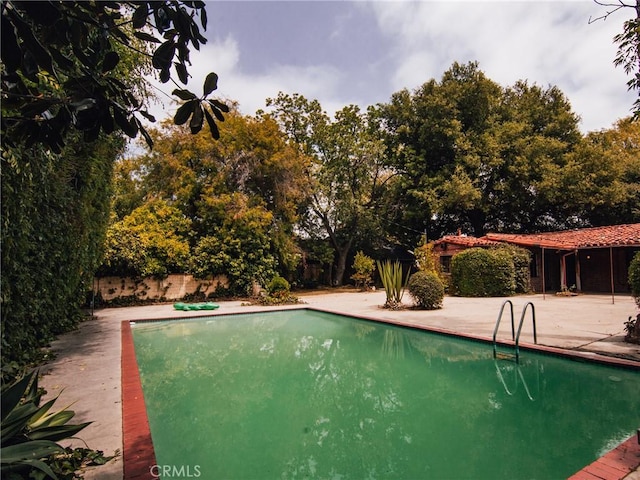 outdoor pool with a patio