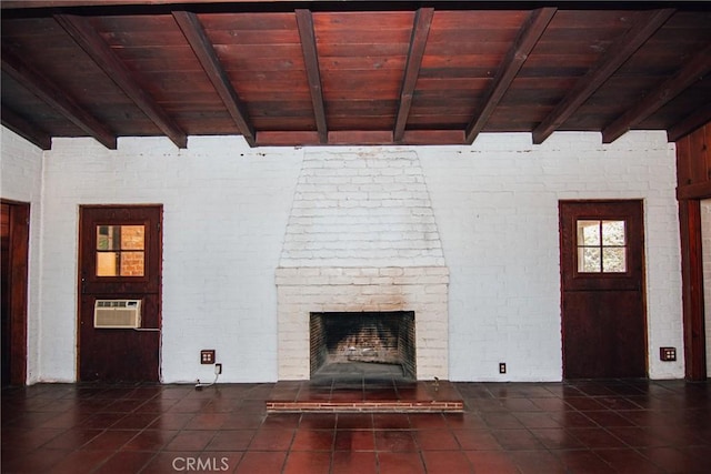 unfurnished living room featuring a brick fireplace, beamed ceiling, wooden ceiling, and tile patterned flooring