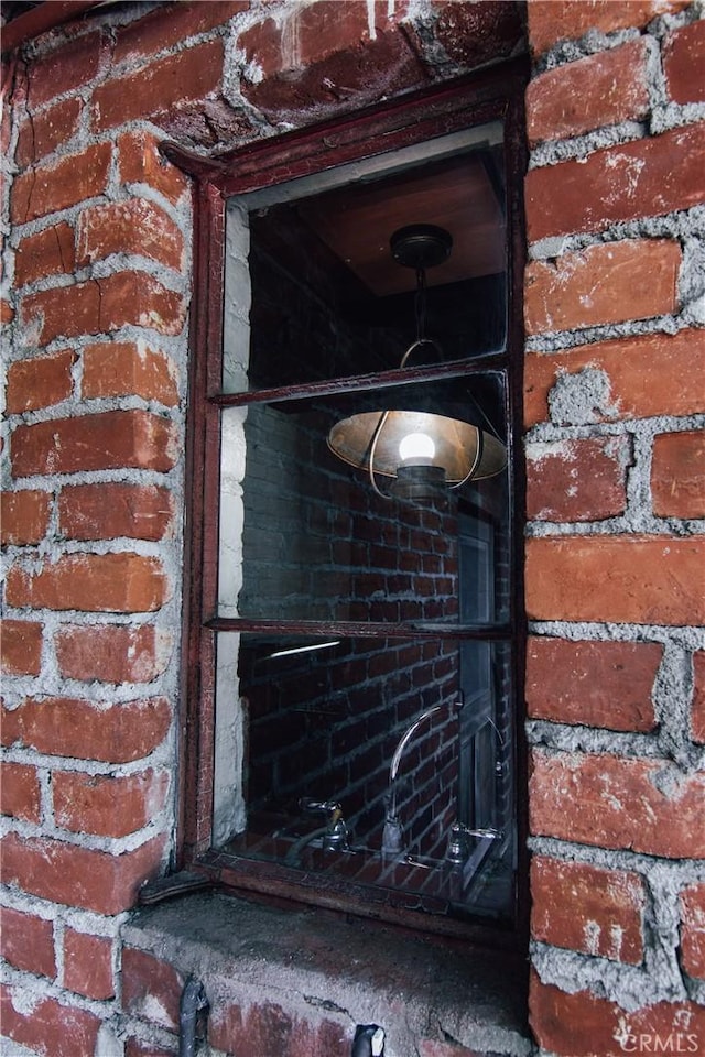 exterior details featuring brick siding