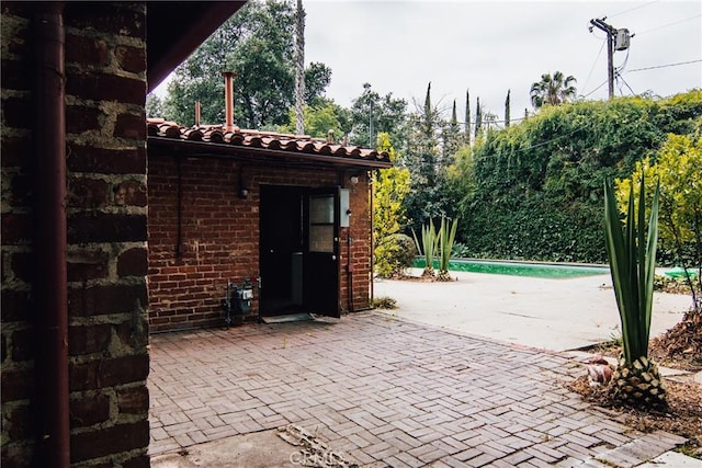 view of patio with an outdoor pool
