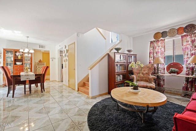 543 S E St, Oxnard, CA 93030 - living area with stairs, a chandelier, and light marble finish flooring
