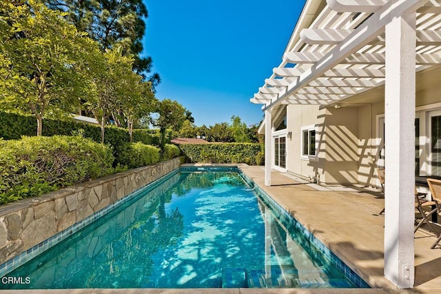 view of pool with a fenced in pool, a pergola, and a patio area