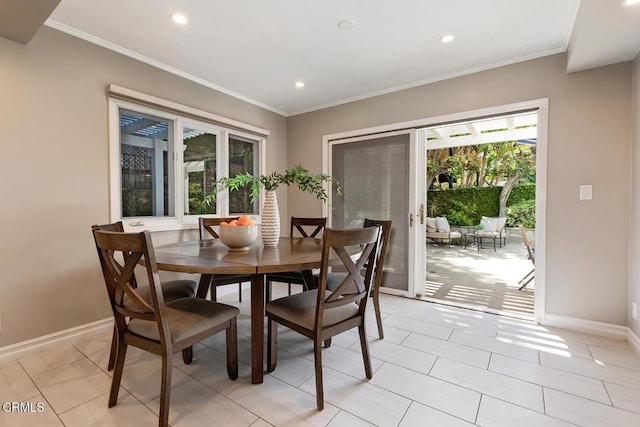 dining room featuring baseboards, recessed lighting, and a wealth of natural light