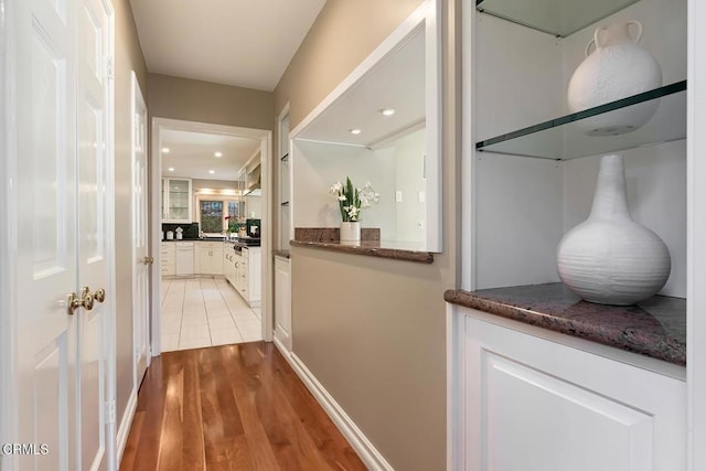 corridor with recessed lighting and light wood-type flooring