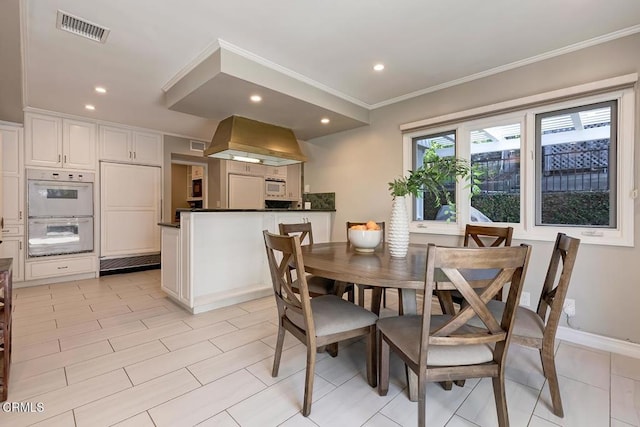 dining space featuring ornamental molding, recessed lighting, and visible vents