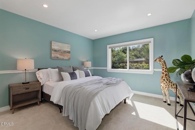 bedroom with baseboards, light carpet, and recessed lighting