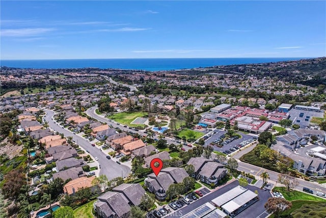 bird's eye view with a water view and a residential view
