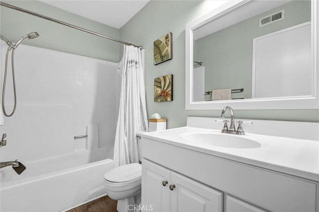 full bath featuring shower / tub combo with curtain, vanity, toilet, wood finished floors, and visible vents