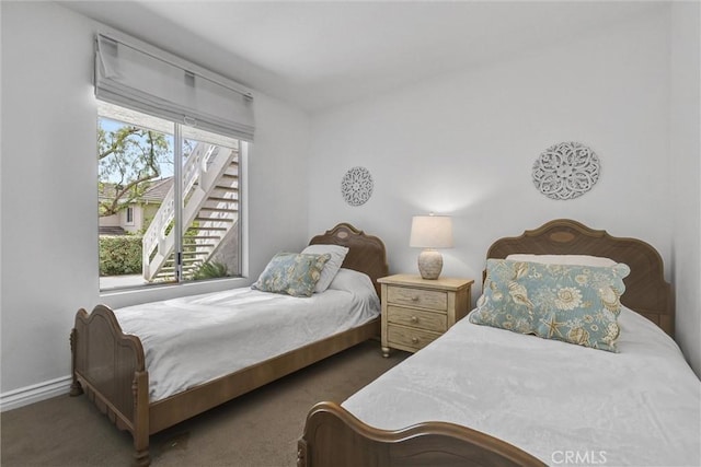 carpeted bedroom with baseboards