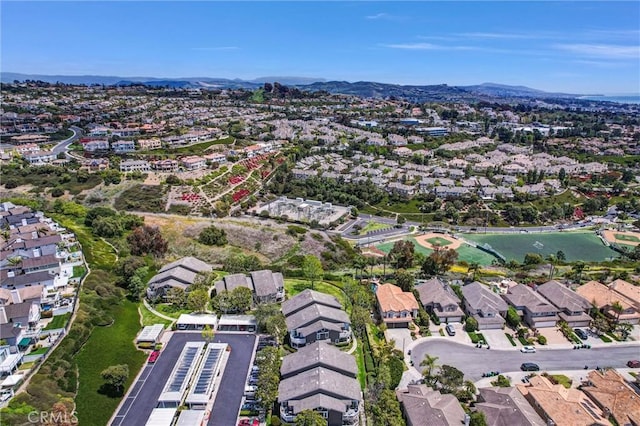 birds eye view of property featuring a mountain view and a residential view