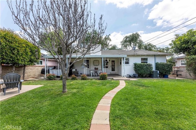 ranch-style house with central AC, fence, a front yard, and stucco siding