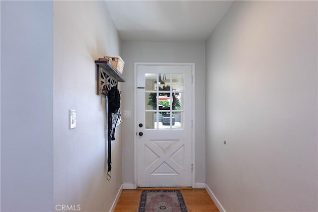 entryway featuring light wood-style floors and baseboards