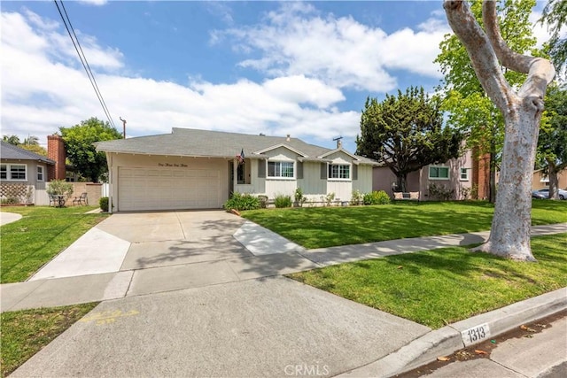 single story home featuring a garage, a front yard, and concrete driveway